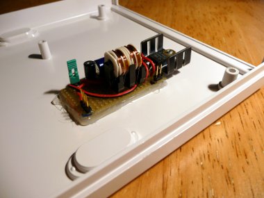 Power supply glued to the enclosure